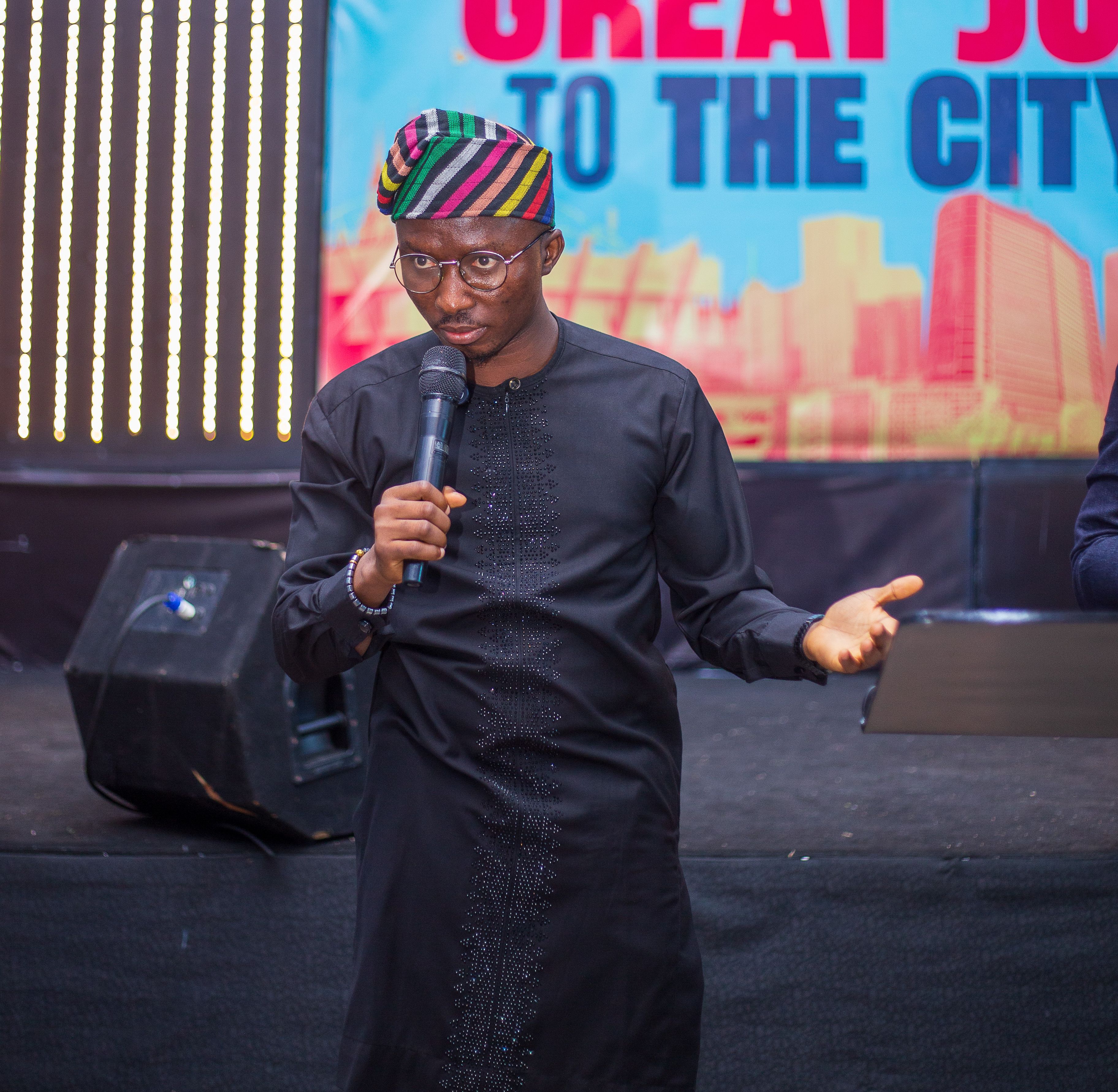 Samuel Adegboyega speaking on stage